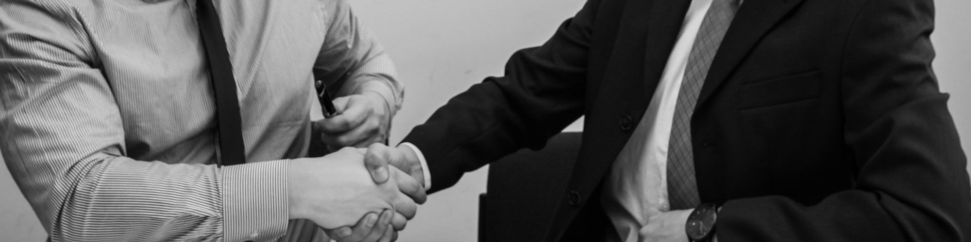 Men Shaking Hands At Job Interview